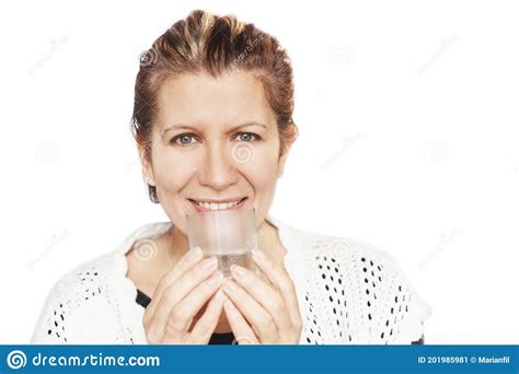 A Pretty Woman Holds A Glass Of Clean Water In Her Hands And Smiles