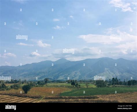 A Scenic View Of Hilly Terrain With Mountains Background In Bukidnon
