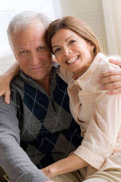 Mature Woman And Senior Man Hugging Stock Photo Dissolve