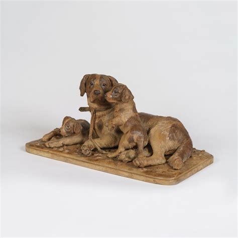 A Black Forest Carved Dog Group Bada