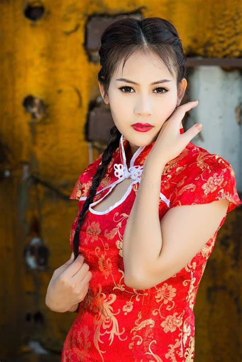 Chinese Girl In Traditional Chinese Cheongsam Blessing Stock Photo