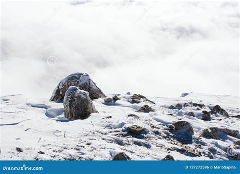 Rocks At The Top Of The Snow Covered Mountain Stock Photo Image Of