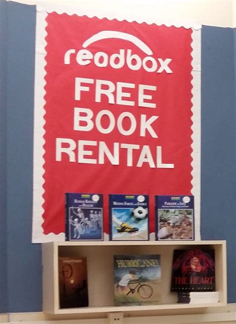 There Is A Sign That Says Redbox Free Book Rental On The Wall Above It