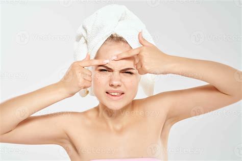 Woman With A Towel On Her Head Squeezes Out Pimples On Her Face Clean