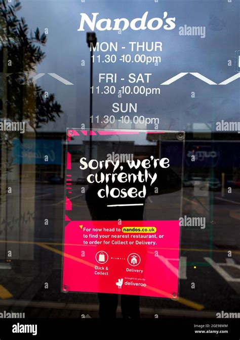 a sign on the doors of a branch of nando s in white city manchester telling customers that the