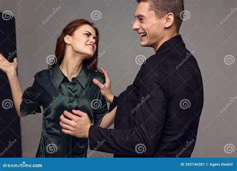 Cheerful Man And Aggressive Woman Slap In The Face Conflict Gray