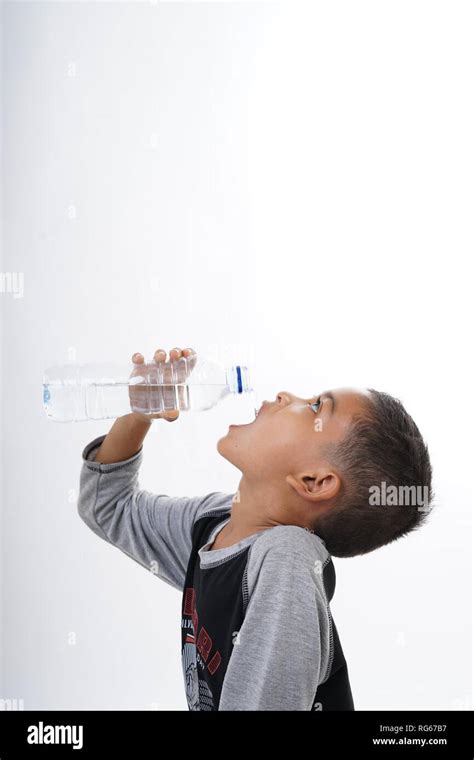 Thirsty Boy Drinking Mineral Water Stock Photo Alamy