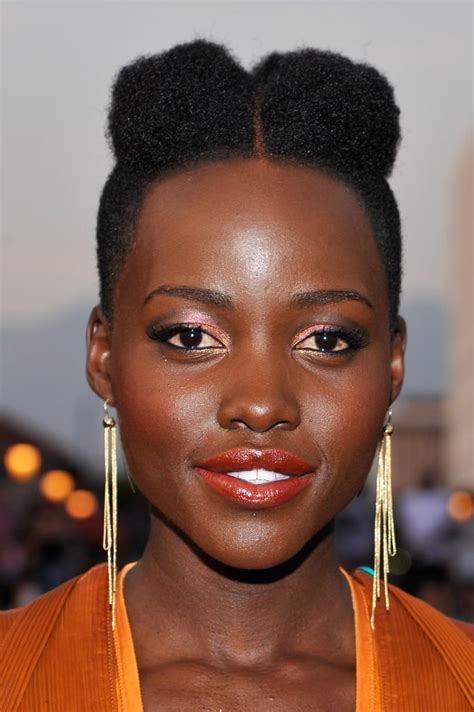 Trending styles for packing gel#ghana briad#ponny tail styles. Afro Puffs | Lupita Nyong'o Hair Ideas | POPSUGAR Beauty Photo 7