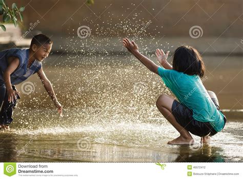 Kids Playing With Water Editorial Photography Image