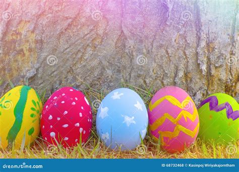 Colorful Easter Eggs Decorated With Flowers In The Grass Stock Photo