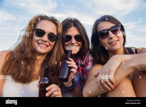 Girls Enjoying In The Park They Are Friends Celebrating The Holiday Having A Good Time Drinking
