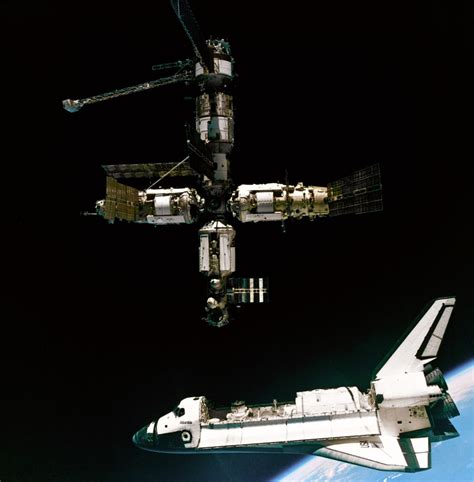 Atlantis Docks With The Russian Space Station Mir Russian Space Station Nasa Space Program