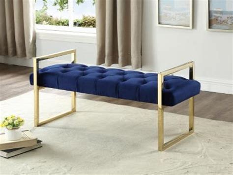 Its spacious interior offers ample space for keeping a variety of items, with a tufted cushioned seat for comfort and style. Navy Blue Velvet Bench