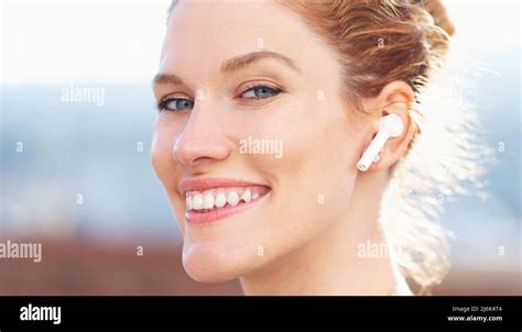 Happy Young Redhead Woman Calling By Hands Free Device Closeup Looking