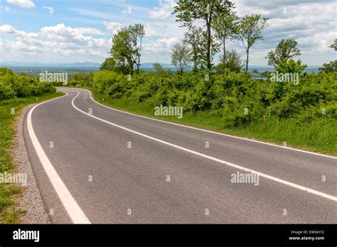 Straight Asphalt Road Leading Into The Distance Stock Photo Alamy