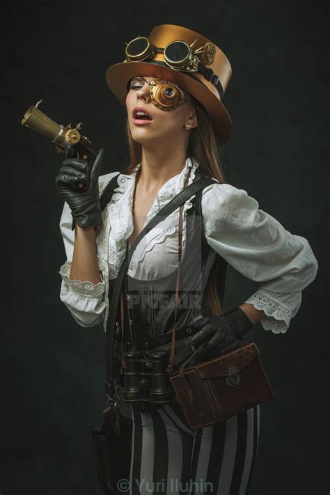 Portrait Of A Beautiful Steampunk Woman Holding A Gun License