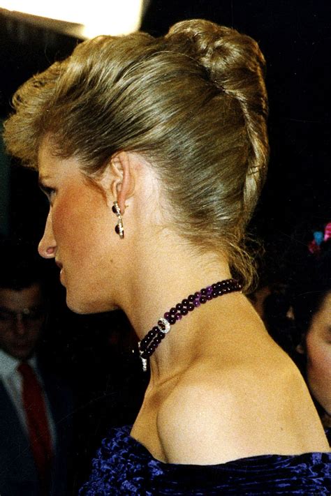1988 in an elegant french twist updo while attending the royal film performance of empire of
