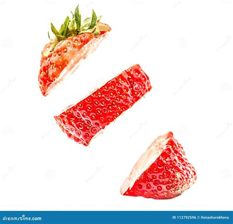Sliced Strawberry Floating In The Air Isolated On White Background