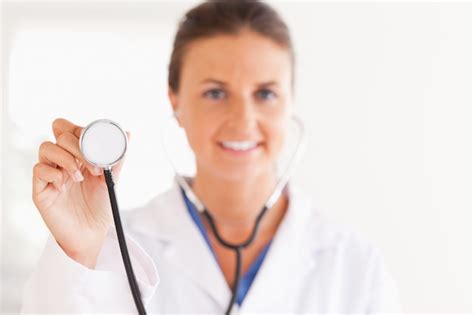 Premium Photo Gorgeous Doctor Showing Stethoscope To The Camera