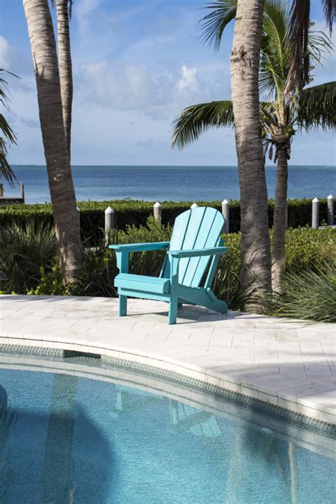 The adirondack chair is one of the most classic pieces of outdoor furniture around—and it's not hard to see why. Poly Resin Teal Adirondack Chair
