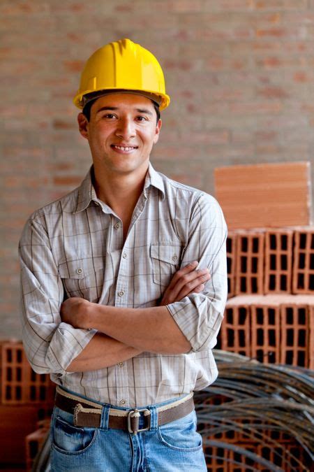 Male Engineer Smiling At A Construction Site Freestock Photos
