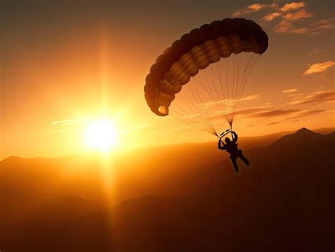 Premium Photo A Person Is Parachuting In Front Of A Sunset