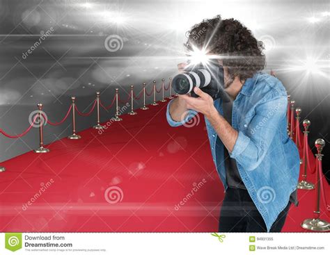 Photographer Taking A Photo With Flash In The Red Carpet Flares