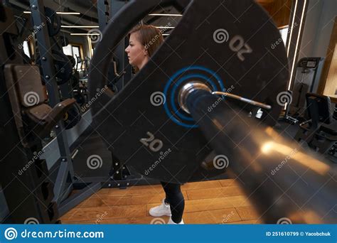 Serious Focused Sportswoman Lifting Barbell At Gym Stock Image Image