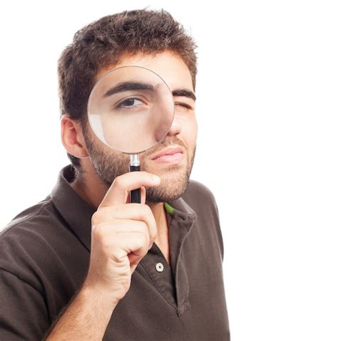 Man Looking Through A Magnifying Glass Photo Free Download