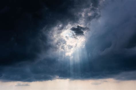 Sun Shining Through Dramatic Dark Clouds · Free Stock Photo