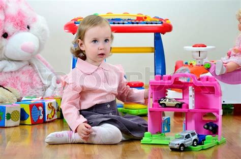 Have fun playing around with these cool 3d dice of varying shapes. Little girl in a room with toys, playing with cars | Stock ...