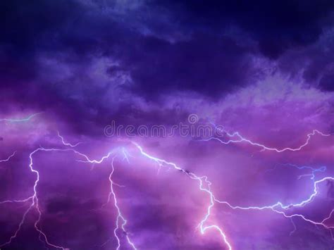 Thunder Storm Lightning Strike On The Dark Purple Cloudy Sky Stock