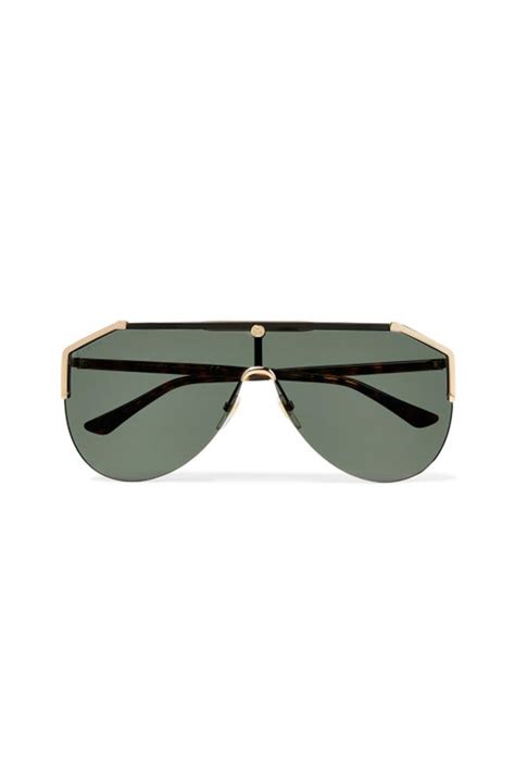 gucci s oversized aviator style sunglasses were designed with ski goggles as a reference the