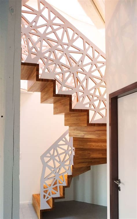 A Stair Case In The Shape Of An Abstract Structure With Wood Treads And