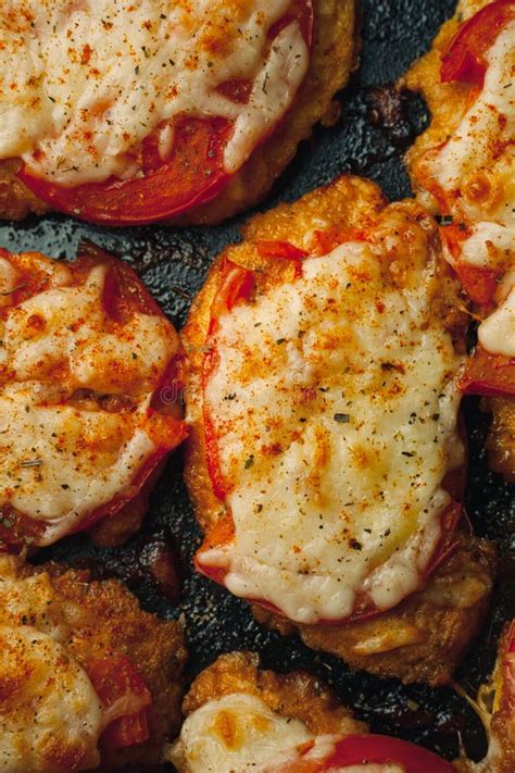 Baked Chicken Fillet With Cheese And Tomato On A Baking Tray For Roasting Meat Dish For The