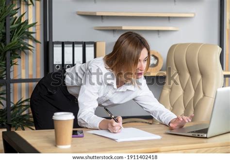 Attractive Female Secretary Working Bending Over Stock Photo Edit Now