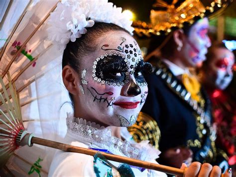 Day Of The Dead Parade In Mexico Features Painted La Catrina Faces And