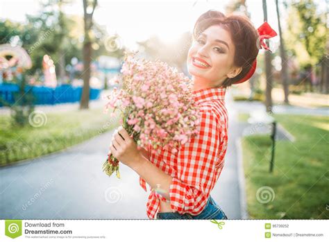 Pinup Girl With Bouquet Of Flowers Retro Fashion Stock
