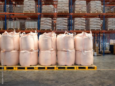 Stacking Of Bulk Cargo In Jumbo Bags Are Store In Warehouse Stock