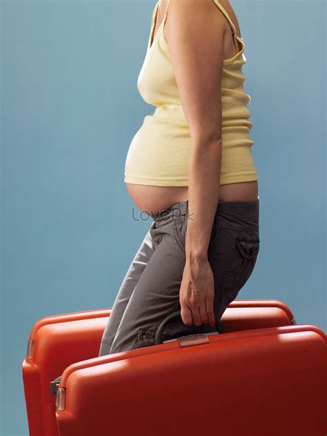 pregnant woman carrying a suitcase picture and hd photos free download on lovepik