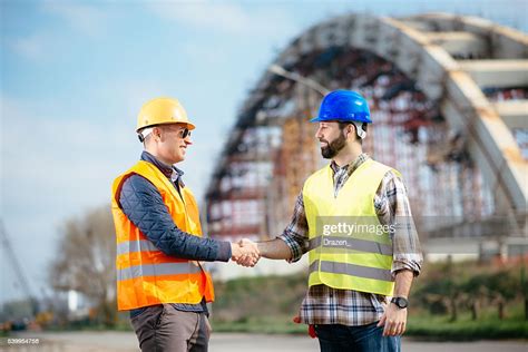 Engineer And Contractor Handshake For Successful Accomplishment Of