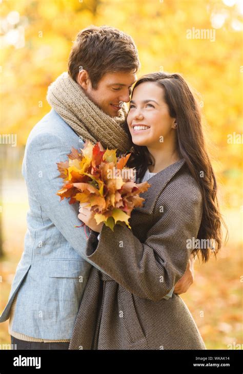 Romantic Couple Kissing In The Autumn Park Stock Photo Alamy