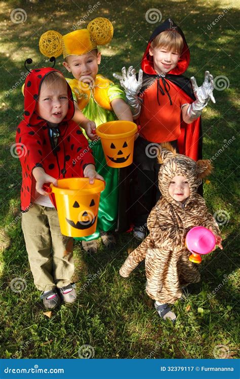 Four Kids Trick Or Treating Stock Image Image Of High Reaching 32379117
