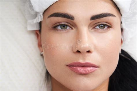 Beautiful Woman Laying At Cosmetologist In Spa Salon Stock Photo