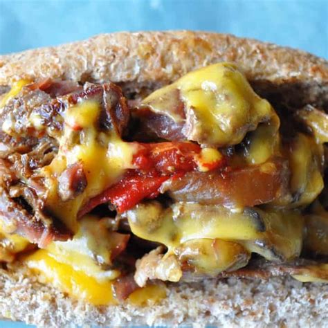 Add onion, peppers, mushrooms and garlic and pour broth on top. Make ahead Crock Pot Philly Cheese Steak freezer meal | Little House Big Alaska