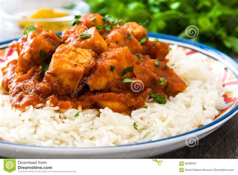 This chickpea tikka masala recipe is an easy dinner to whip up when the indian food cravings hit (plus, it's vegan!) i know i'm not supposed to admit this on account of being a *food blogger* and all, but we have an ordering in problem. Chicken Tikka Masala With Basmati Rice On Wood Stock Image ...