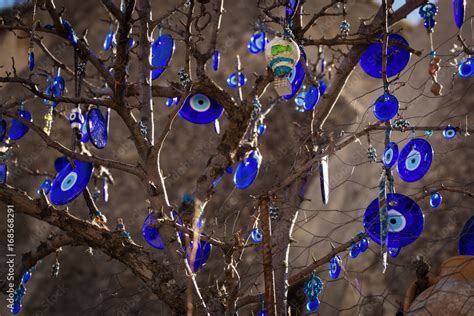 The Branches Of The Old Tree Decorated With The Eye Shaped Amulets