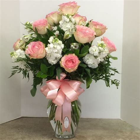 Pink Roses White Stock And White Alstroemeria With A Pink Satin Bow