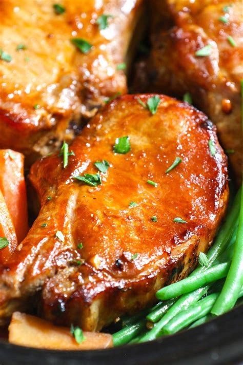 Add sliced apples or make your own applesauce for sweetness and some matchstick carrots and sliced onions to punch up the. Closeup of Slow Cooker Pork Chops made with bone in rib ...