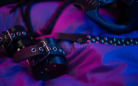 Leather Bdsm Handcuffs And Accessories For Bdsm Games In Neon Light Stock Image Image Of